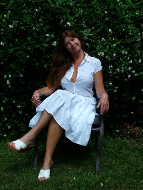 Older lady Dee Delmar pulls out her big boobs as she strips naked 50257885