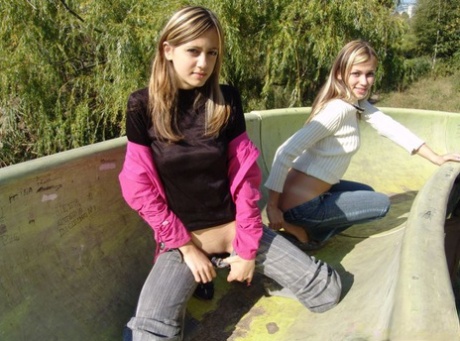 Teen lesbians head to a public park to flash their boobs and bums 85035389