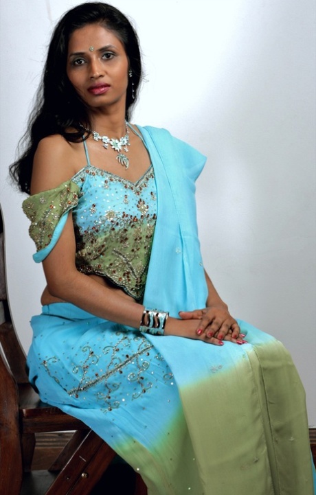 Indian woman models in a strapless bra and panties paired with red hosiery 59403765